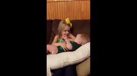 Adorable Girl Serenades New Baby Brother