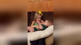 Newsflare Edit - Adorable Girl Serenades New Baby Brother