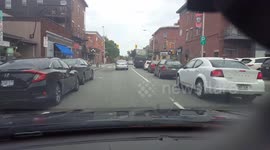 close call with woman who blindly pulls out of parking spot