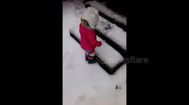 Toddler face plants in the snow