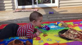 Parents use pizza to motivate their baby to crawl