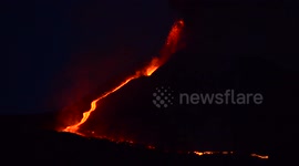 Lava flows down Mount Etna slope