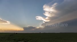 Sunset behind a building thunderstorm in Kansas.