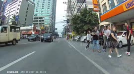 Distracted jaywalkers almost get hit by cyclist