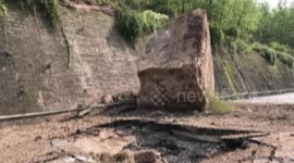 Giant stones roll down the hill and hit the motorway