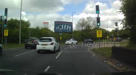 How not to tow a trailer with 2 cars over a roundabout.