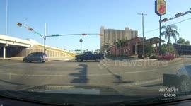 Grey SUV crashes into turning vehicle