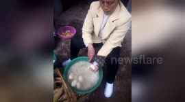 Woman somehow avoids cutting her hand off while chopping potatoes dangerously