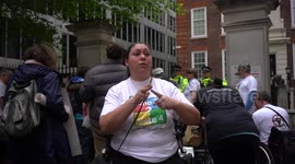 A disable person sign languages protest against Tories benefit cuts