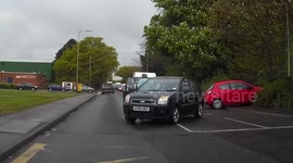 Car takes corner at speed and crashes