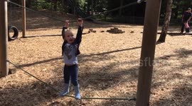 Little girl gets stuck on wobbly tightrope at playground