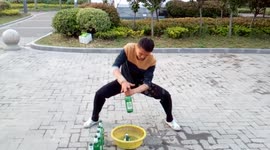 Martial artist uses kung fu to smash bottles