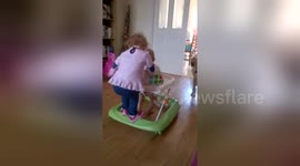 Newsflare Edit - Toddler hitches a ride on baby in walker