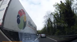 Hilarious moment car rolls backwards in heavy traffic and mounts a tree