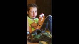 Teenage girl doing Kylie Jenner lip challenge