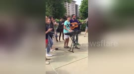 Romantic youngster performs Ed Sheeran song for prom proposal