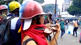 VENEZUELA POLITICS: Violinist plays national anthem amid protest chaos