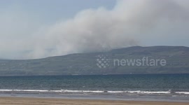 Looking Across Benone Beach At Raging Gorse Fire Over Donegal