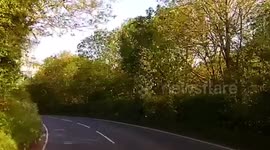Young Devon Girl Driver overtaking two cars on a bend of a main country road ,Near miss head on with truck