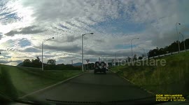 Driver crosses two lanes from off ramp, almost causes collision.
