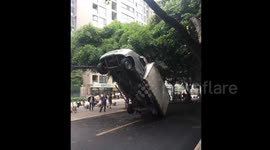 Lorry tilted up 45 degrees by falling down wires