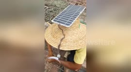 Creative Chinese builders create make-shift solar-powered fans for their hats