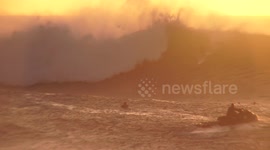 surfer on wave banzai pipeline sunset
