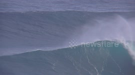 big wave tow surfing