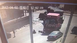 Scooter driver narrowly escapes being run over by lorry