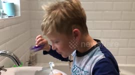 Doesnt even put it down whilst brushing his teeth