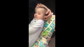 Baby falls asleep to ear massage