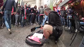 Ajax fans shower busker with money