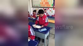 School boy gets emotional while reading out loud in class