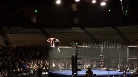 Pro Wrestlers Cody Rhodes & Joey Ryan perform a Superplex fall from the Top of a Steel Cage!