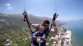 Girl, 4, goes paragliding with her dad
