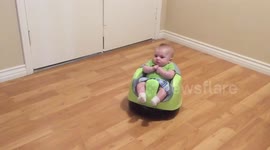 Cute baby rides robot vacuum cleaner customised by parents