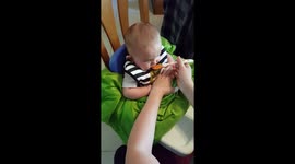 Baby eating sweet potatoes