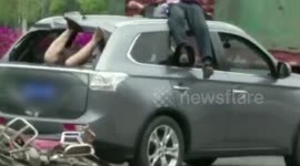 Motorcycle rare-ends car causing bizarre result in southern China