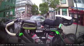 Man leaves his own bike in the middle of road to try and steal another one from the back of a car