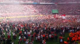 FC Köln fans run onto pitch after qualifying for Europa League