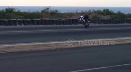 Newsflare Edit - Motorcyclist crashes while performing high speed wheelie