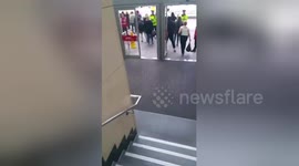 Armed police officers evacuate Manchester's Arndale shopping centre