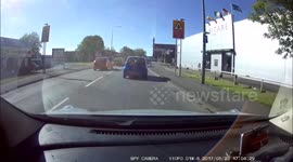 young lady driver using her mobile phone bumps into the rear of a astra