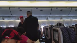 Belligerent man in red Donald Trump hat removed from United Airlines flight