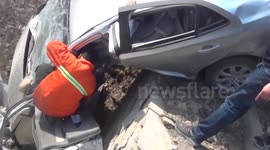 Driver Pulled from Vehicle Stuck on Cliff