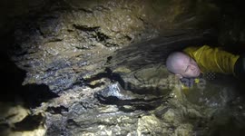 Intense caving expedition results in man being stuck as water slowly rises