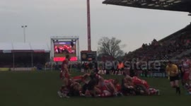 Rugby pitch invader takes a big hit