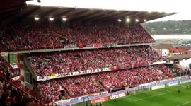 Fans launch masses of toilet roll at football pitch
