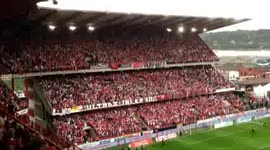 Fans launch masses of toilet roll at football pitch