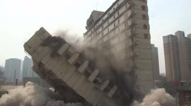 Remarkable moment crew demolishes exactly half of building